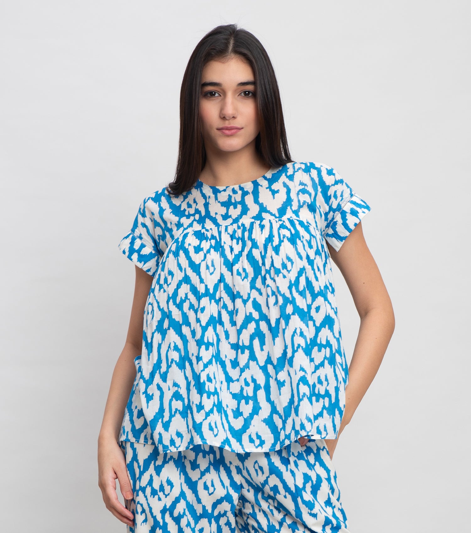 Sky Blue Cotton Printed Top with pintucks On Yoke & Thread Detail On Sleeves